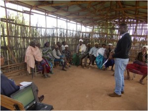 Pastoralists gather to learn about the index-based livestock insurance from insurance agents and researchers.