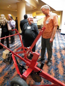Harry Rea, USAID AOR, and PI Jay Norton with a prototype of the multifunctional implement (MFI). The MFI substantially increases the efficiency of lo/no-till cultivation (lo/no-till being one of the three keystones of conservation ag as defined by the FAO).  The MFI will play a key role in the future of CAPS projects in eastern Uganda and Kenya. 